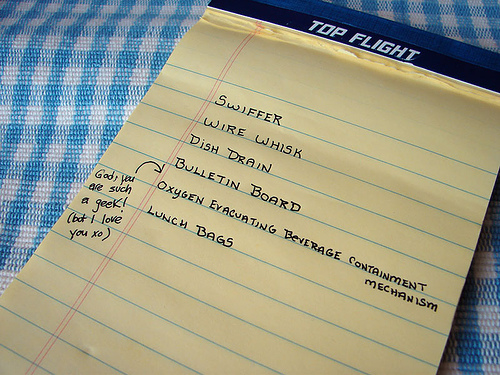 Grocery list written on a yellow legal pad